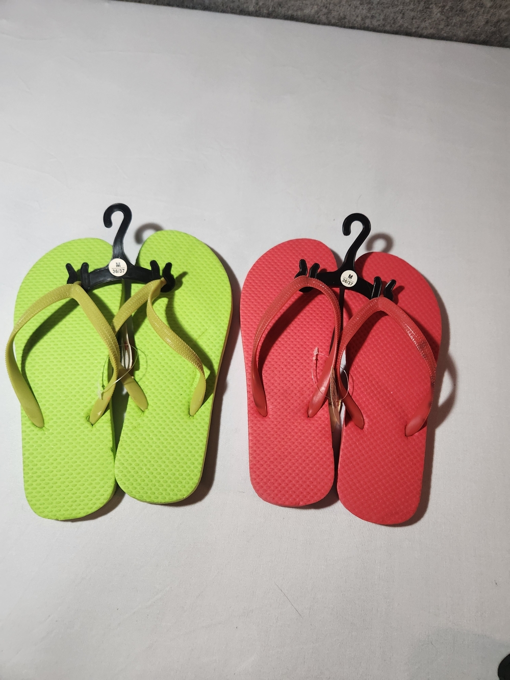 Red and green flip flops Size Medium 6/ 7